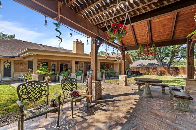 a view of a chairs and table in a patio