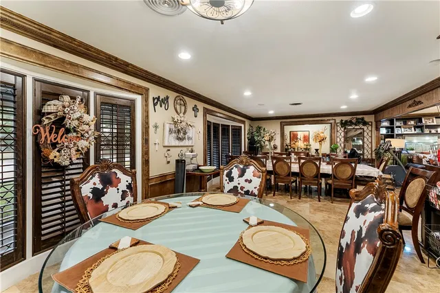 a very nice looking dining room with furniture