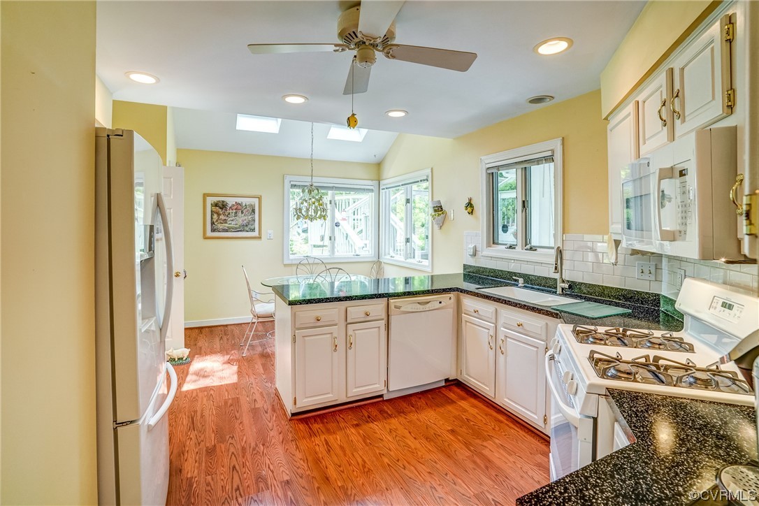 3113 Stony Point Road, Unit UE Richmond, VA 23235 - Photo 23 of 48 a kitchen with stainless steel appliances granite countertop a stove a sink and a refrigerator