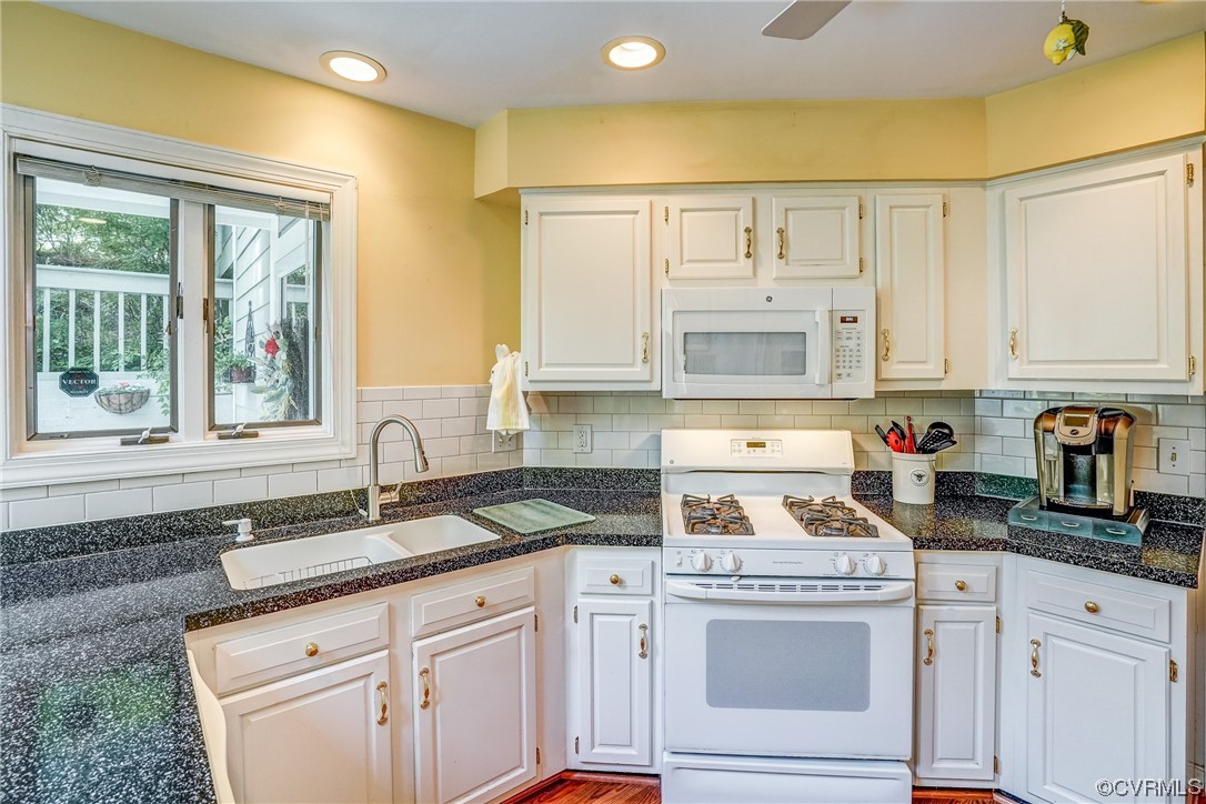 3113 Stony Point Road, Unit UE Richmond, VA 23235 - Photo 25 of 48 a kitchen with granite countertop white cabinets and a sink