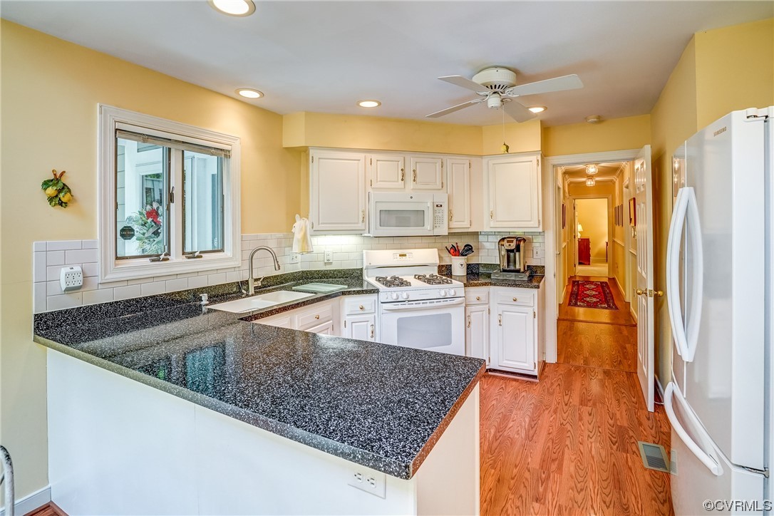 3113 Stony Point Road, Unit UE Richmond, VA 23235 - Photo 27 of 48 a kitchen with stainless steel appliances granite countertop a sink stove and refrigerator