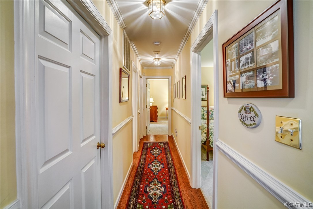 3113 Stony Point Road, Unit UE Richmond, VA 23235 - Photo 30 of 48 a hallway with painting on the wall and a large mirror next to a window