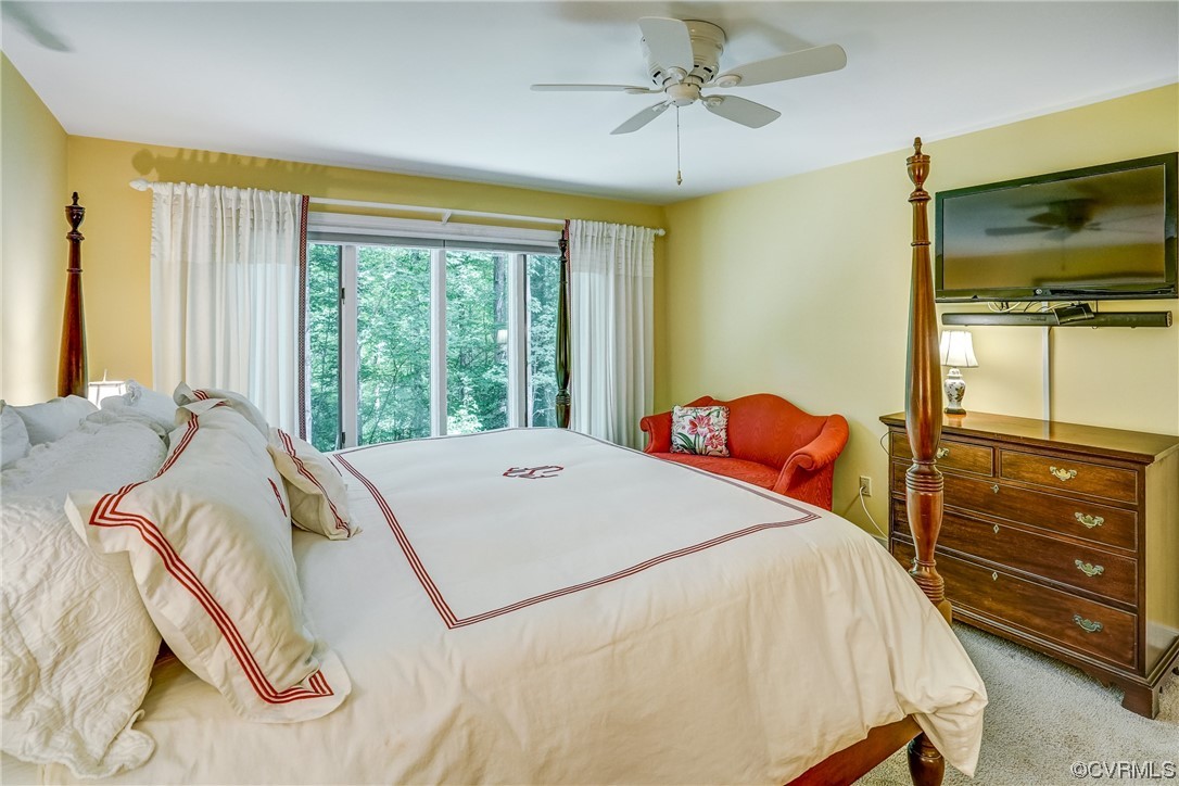 3113 Stony Point Road, Unit UE Richmond, VA 23235 - Photo 32 of 48 a bed sitting in a bedroom next to a window