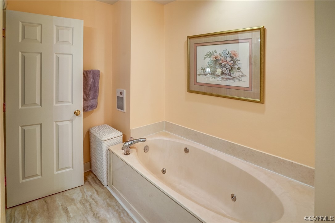 3113 Stony Point Road, Unit UE Richmond, VA 23235 - Photo 36 of 48 a white bath tub sitting next to a white walls