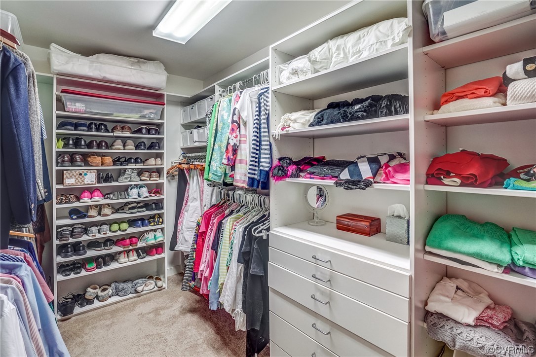 3113 Stony Point Road, Unit UE Richmond, VA 23235 - Photo 37 of 48 a view of walk in closet with clothes and shoes