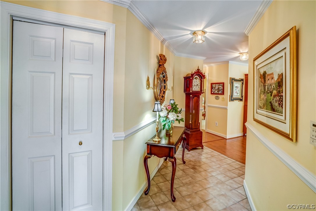 3113 Stony Point Road, Unit UE Richmond, VA 23235 - Photo 8 of 48 a living room with furniture and a chandelier