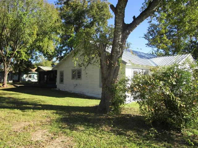 a view of a house with swimming pool