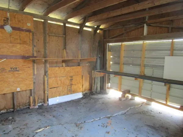 a view of a room with wooden walls