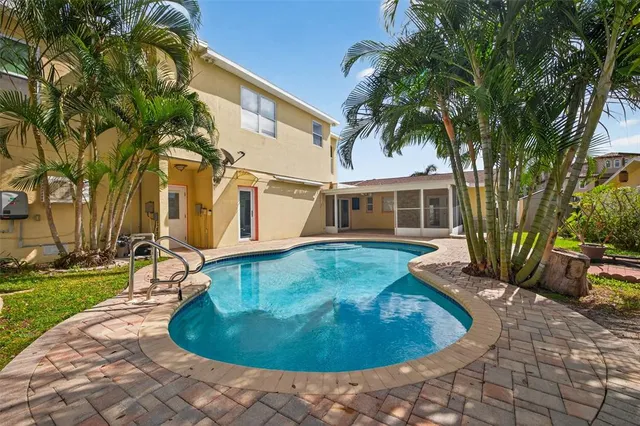 a spacious bathroom with a granite countertop sink and a mirror