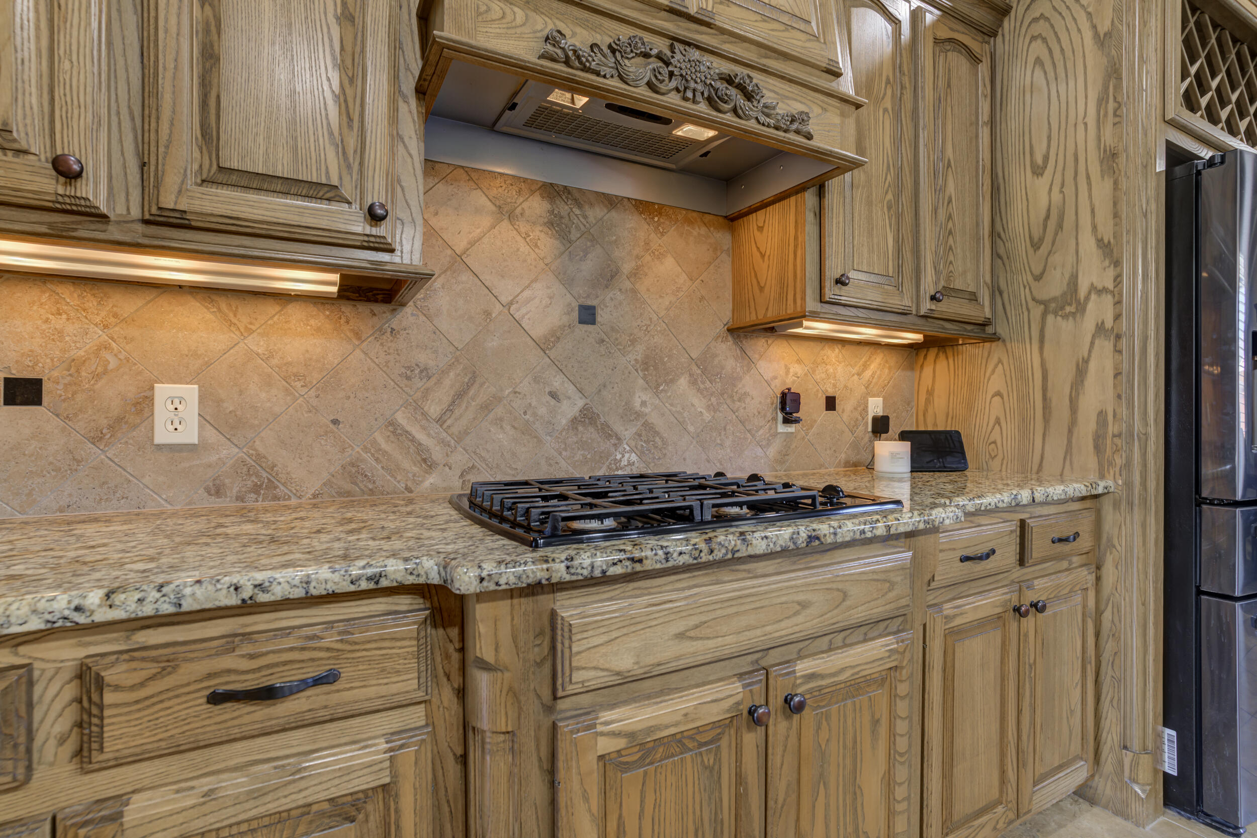 6008 89th Street Lubbock, TX 79424 - Photo 21 of 61 a kitchen with stainless steel appliances granite countertop a stove and a sink