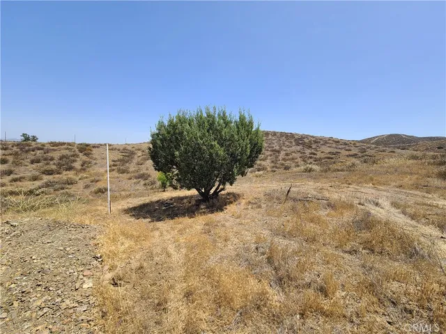 a large building with a mountain in the background