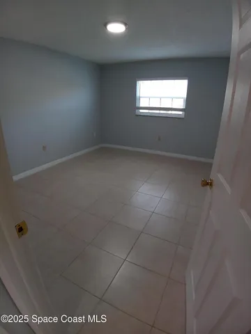 en empty room with windows