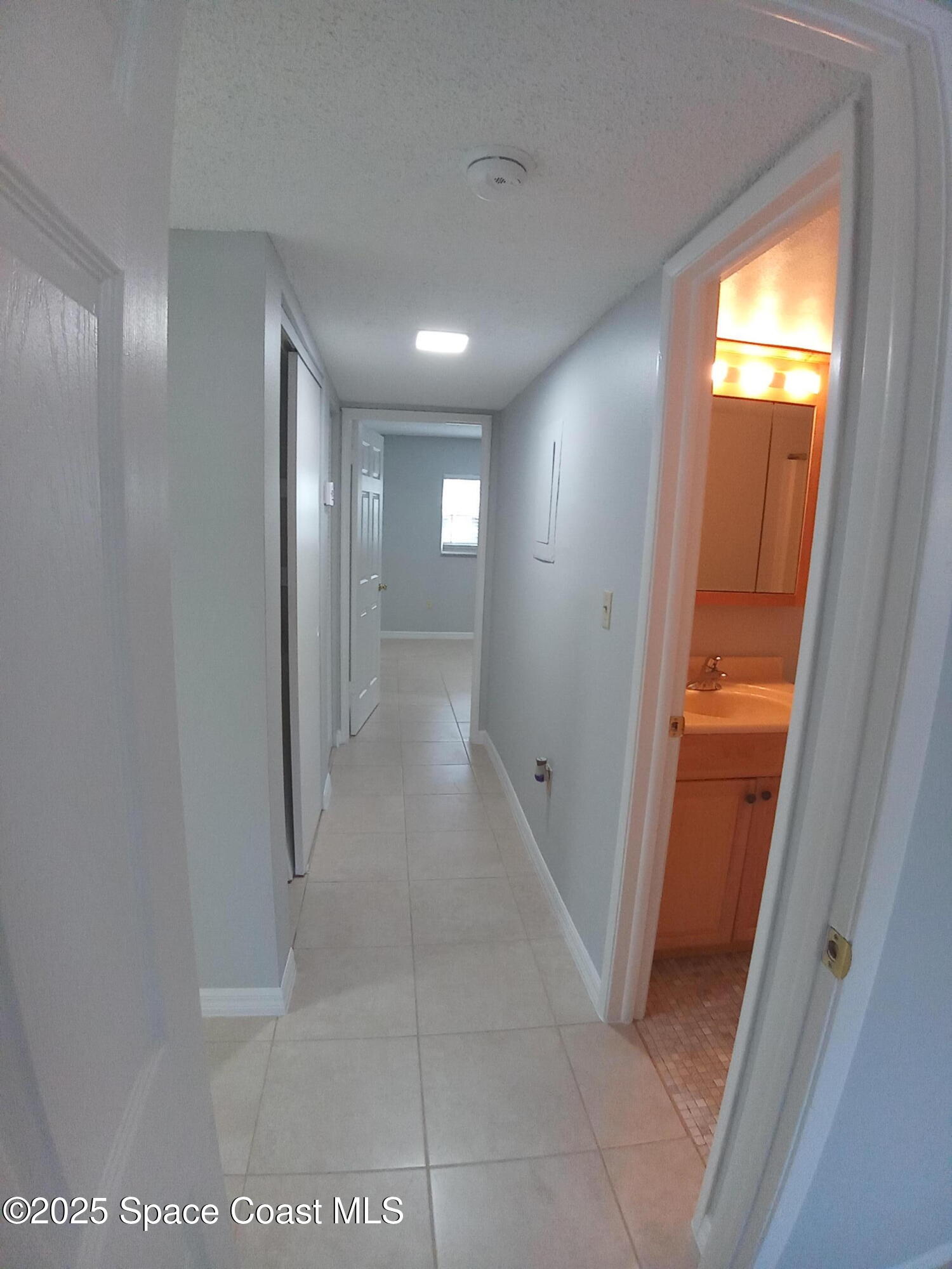 183 Ulster Lane Melbourne, FL 32935 - Photo 16 of 43 a view of a hallway