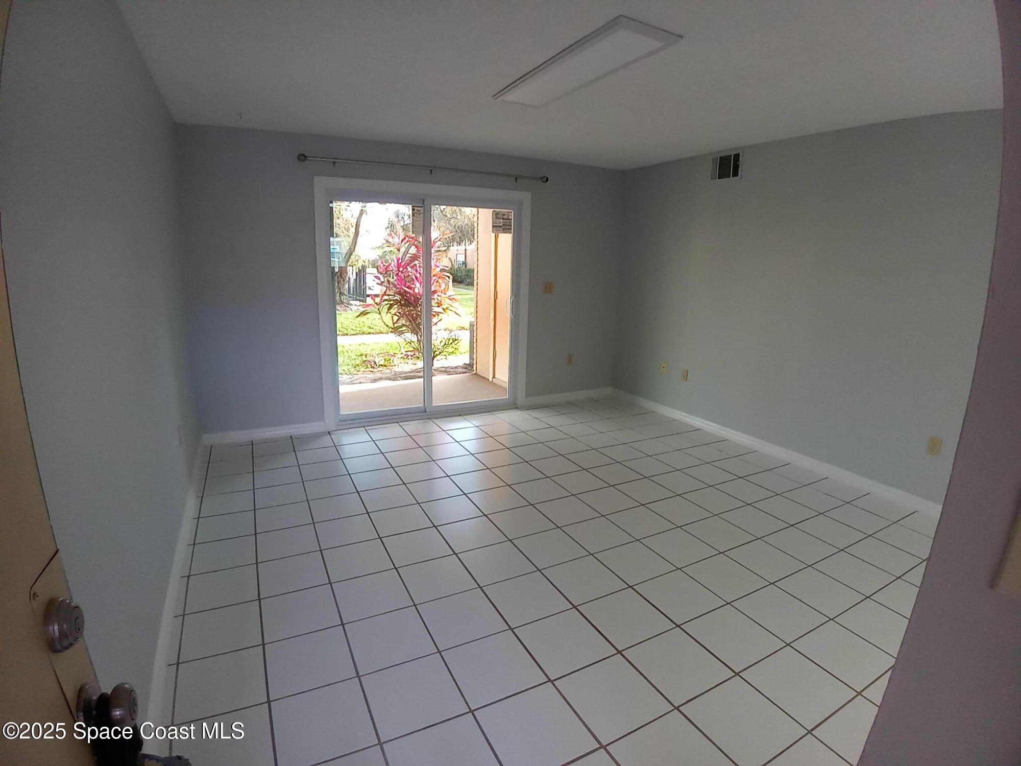 183 Ulster Lane Melbourne, FL 32935 - Photo 2 of 43 a view of an empty room and window