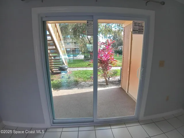 a view of a room that has a large window