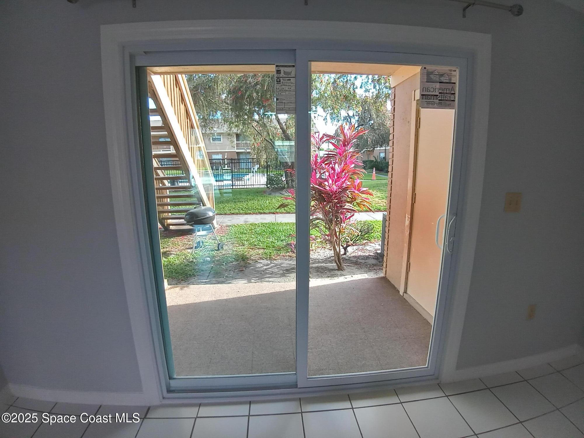 183 Ulster Lane Melbourne, FL 32935 - Photo 3 of 43 a view of a room that has a large window