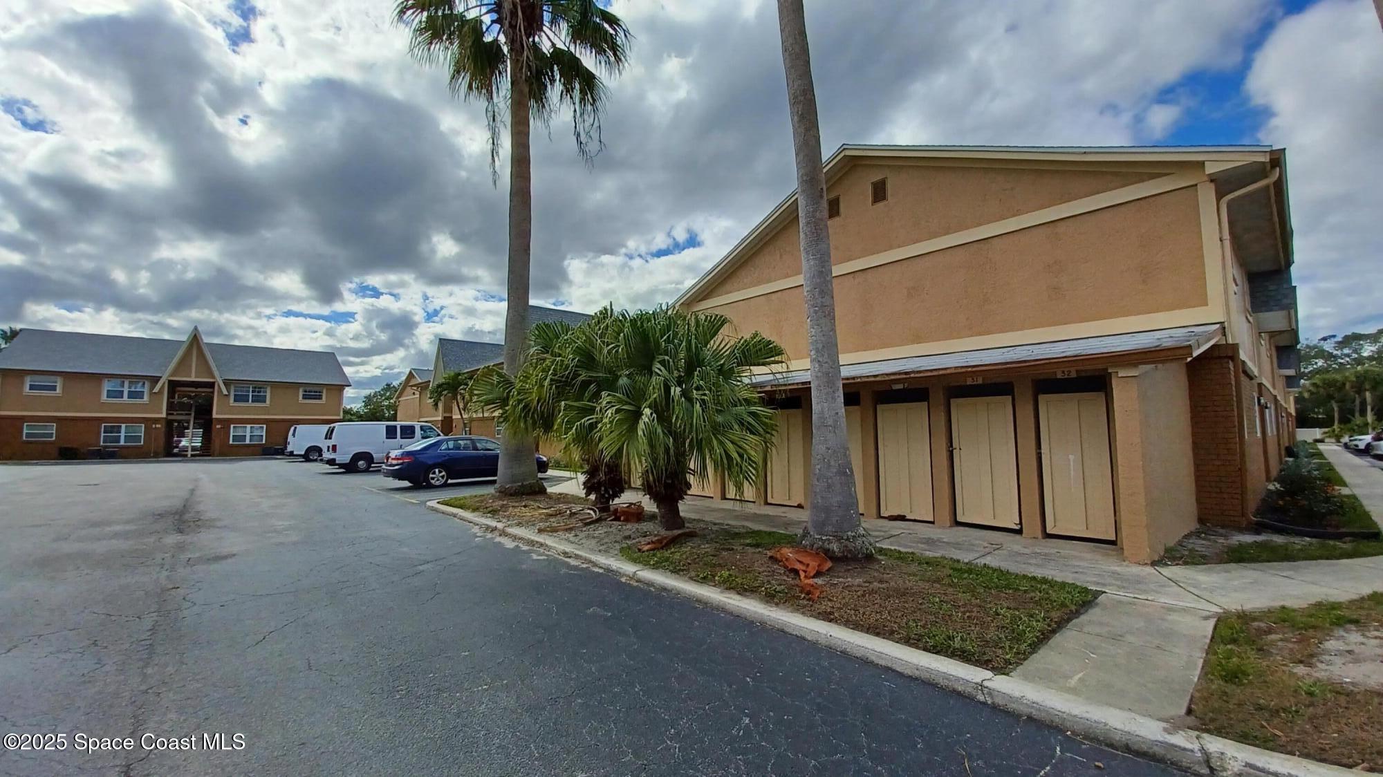 183 Ulster Lane Melbourne, FL 32935 - Photo 33 of 43 a view of a street with cars