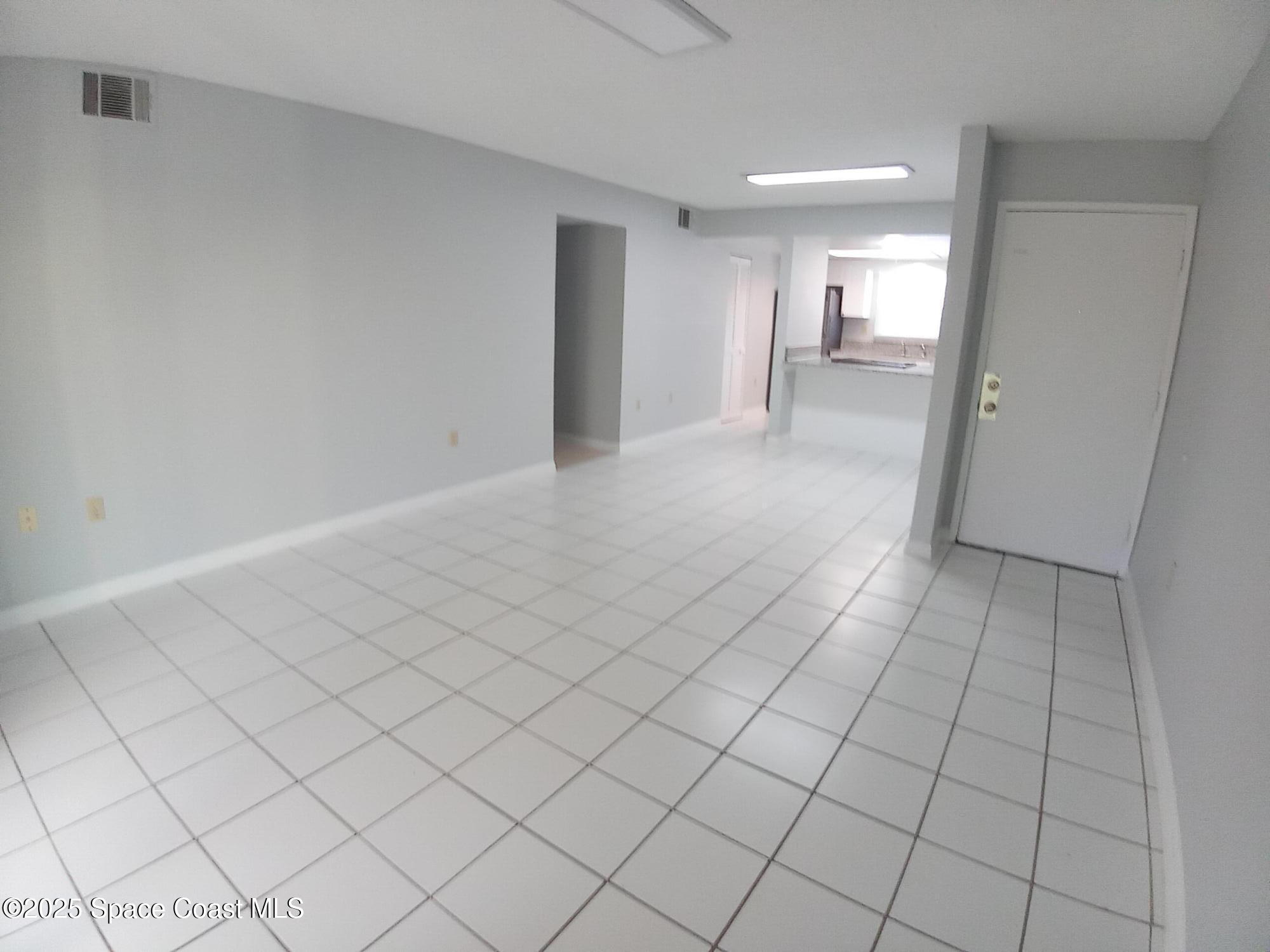 183 Ulster Lane Melbourne, FL 32935 - Photo 5 of 43 a view of an empty room and window