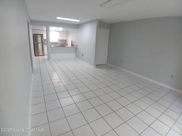 a view of a livingroom and entryway