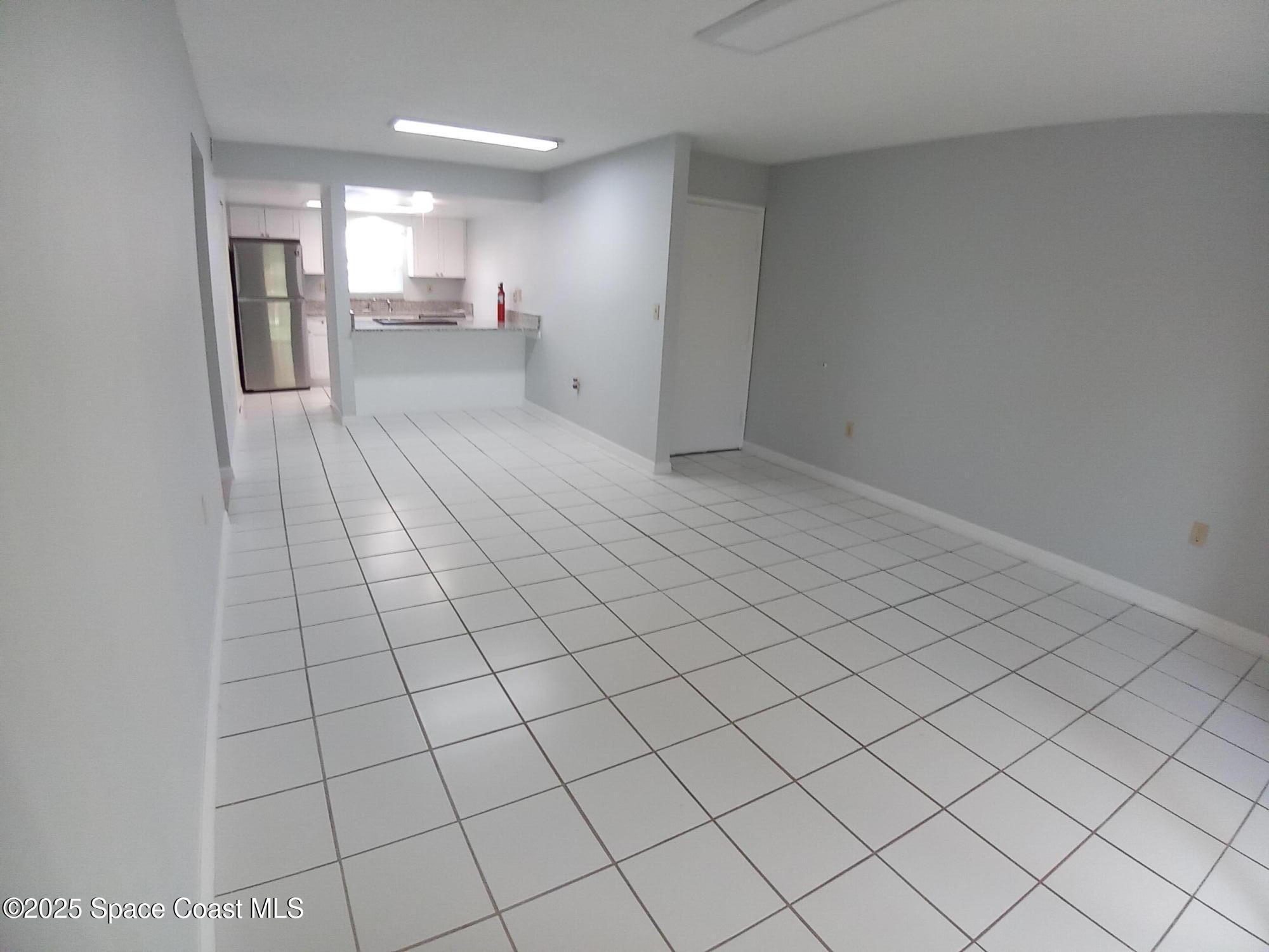 183 Ulster Lane Melbourne, FL 32935 - Photo 6 of 43 a view of a livingroom and entryway