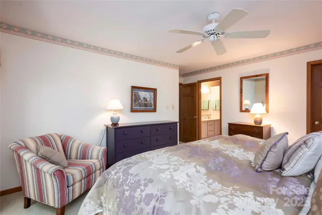 a bedroom with a large bed and closet