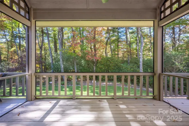 a view of a porch with a floor to ceiling window