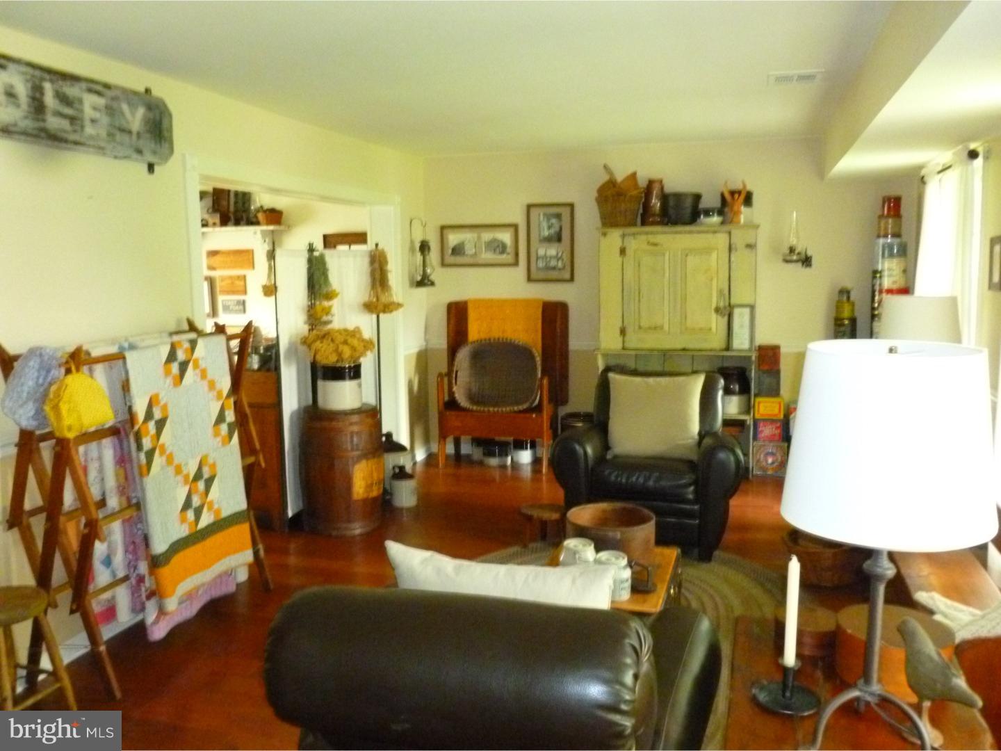 37 Manchester Road Eastampton, NJ 08060 - Photo 13 of 25 a living room with furniture and a table
