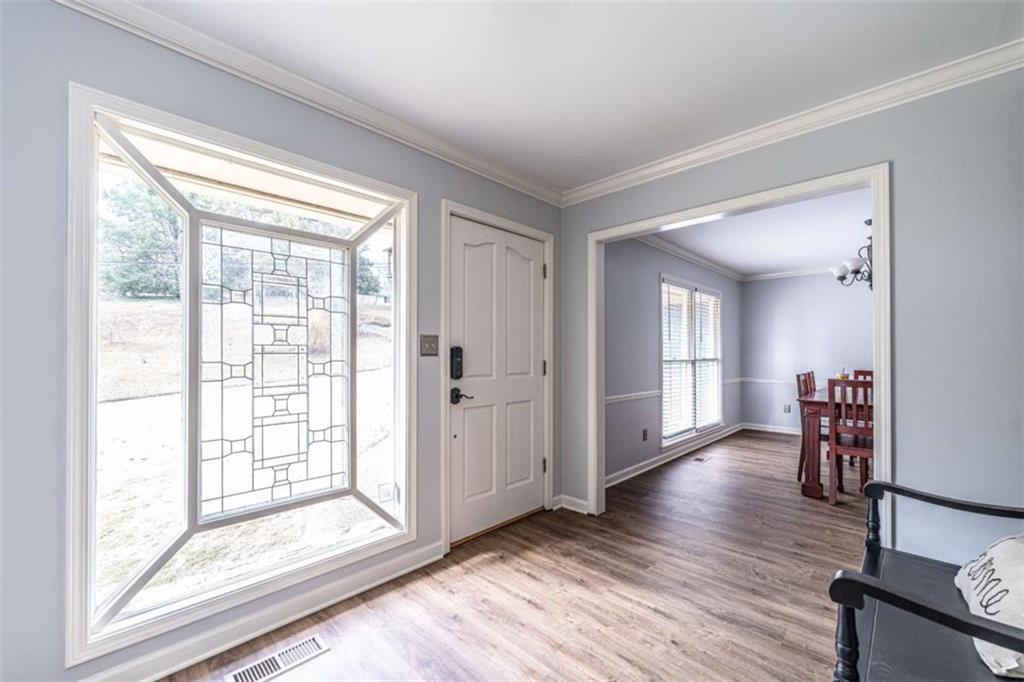 27 Saddle Mountain Road Southeast Rome, GA 30161 - Photo 3 of 36 a view of a livingroom with wooden floor
