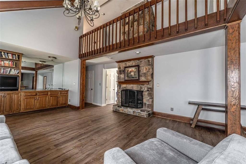 27 Saddle Mountain Road Southeast Rome, GA 30161 - Photo 7 of 36 a living room with furniture and a fireplace