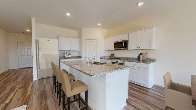 a kitchen with a sink and faucet