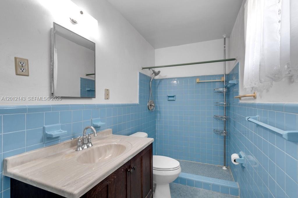 5651 Northwest 3rd Street Miami, FL 33126 - Photo 13 of 21 a bathroom with a sink toilet and shower
