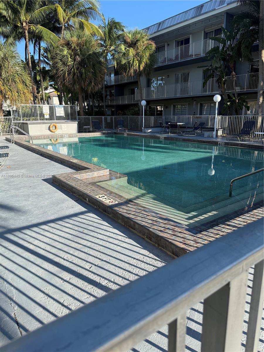 7403 Southwest 82nd Street, Unit 109N Miami, FL 33143 - Photo 15 of 16 a view of a street with houses on both side
