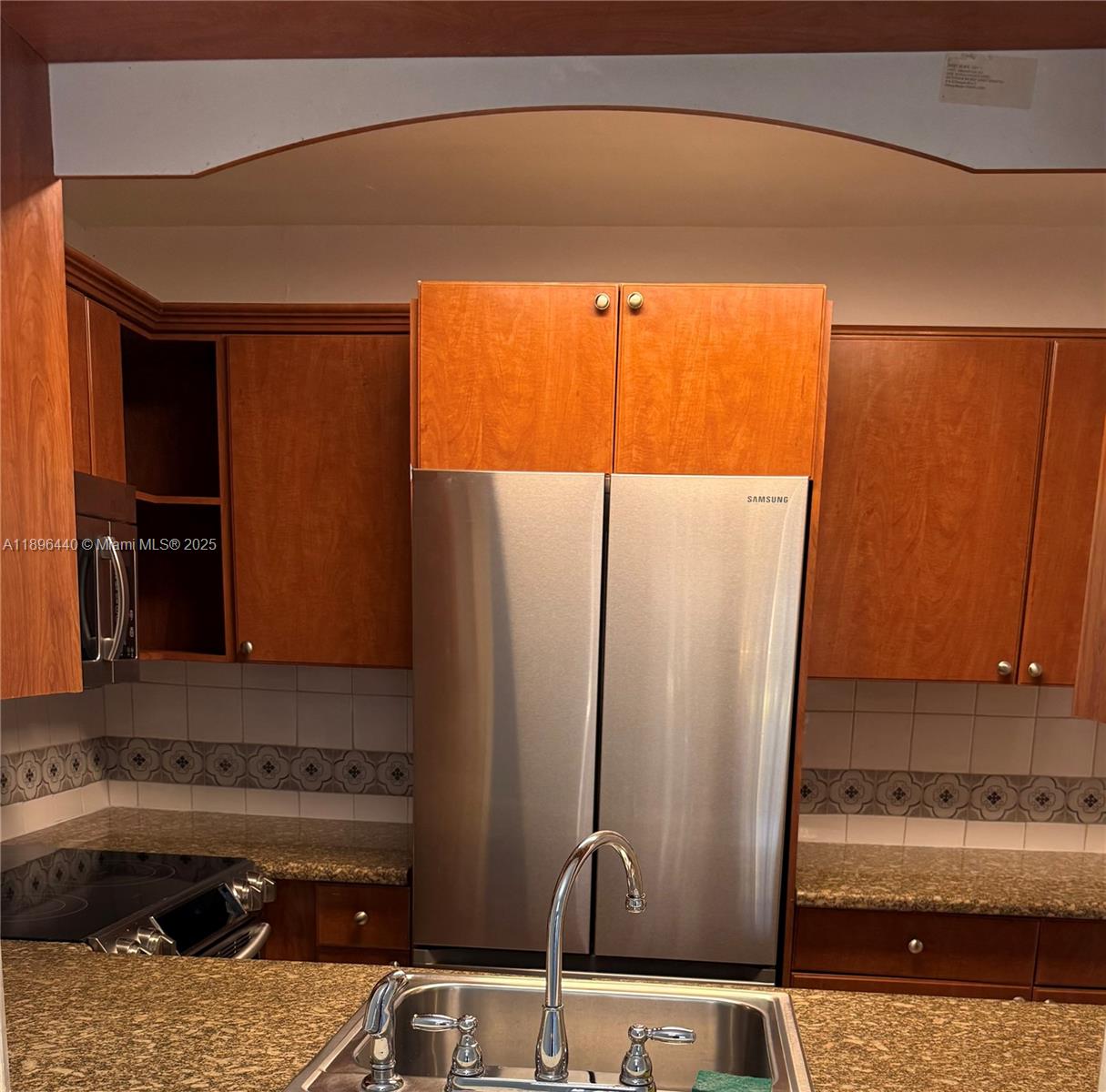 7403 Southwest 82nd Street, Unit 109N Miami, FL 33143 - Photo 6 of 16 a bathroom with a sink and a mirror