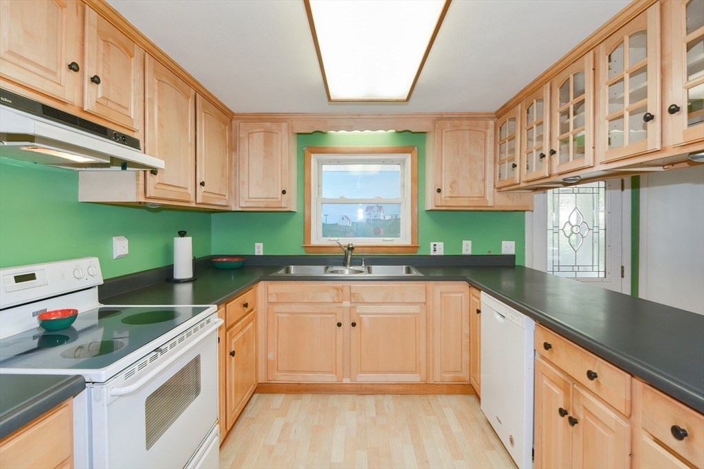 40 Eastern Avenue Lunenburg, MA 01462 - Photo 18 of 42 a kitchen with stainless steel appliances granite countertop a sink and cabinets