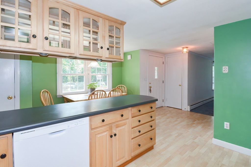 40 Eastern Avenue Lunenburg, MA 01462 - Photo 21 of 42 a kitchen with granite countertop a sink and a wooden floors