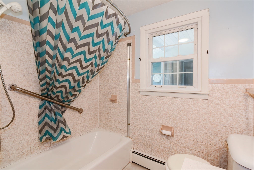 40 Eastern Avenue Lunenburg, MA 01462 - Photo 26 of 42 a bathroom with a sink a toilet and a bathtub