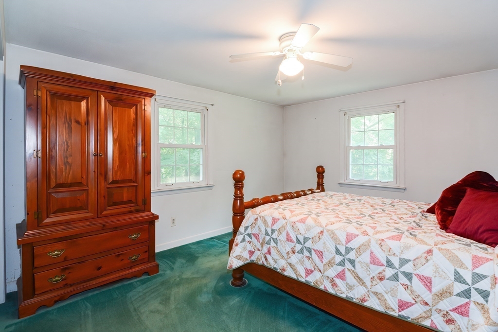 40 Eastern Avenue Lunenburg, MA 01462 - Photo 27 of 42 a bedroom with a bed and a table