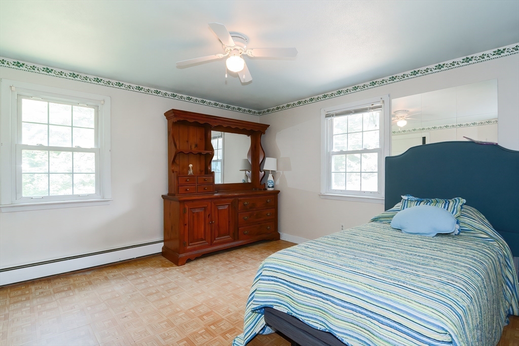 40 Eastern Avenue Lunenburg, MA 01462 - Photo 30 of 42 a bedroom with a bed and a dresser next to a window