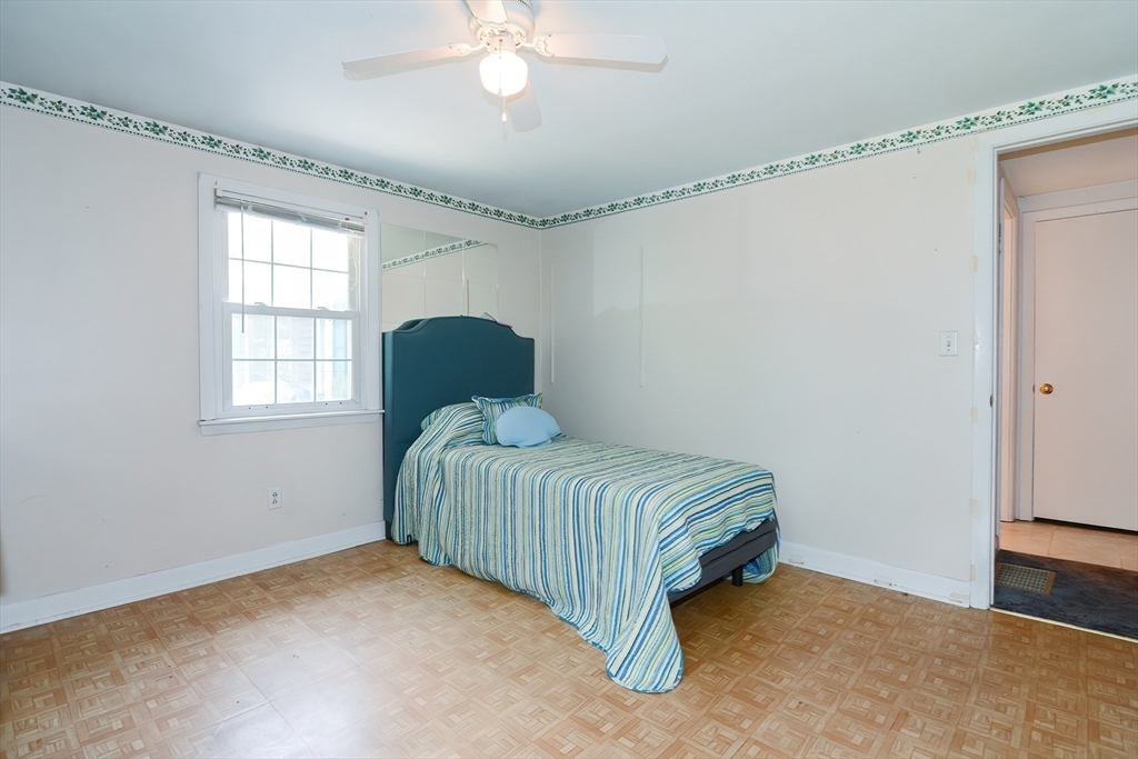 40 Eastern Avenue Lunenburg, MA 01462 - Photo 32 of 42 a bedroom with a bed and window