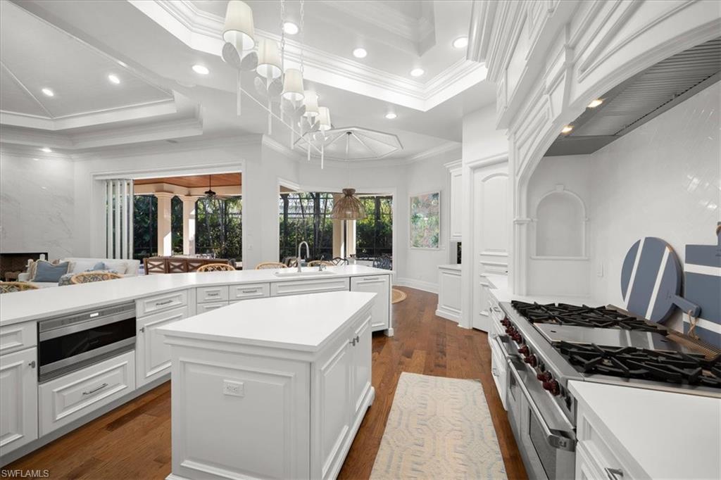 610 Springline Drive Naples, FL 34102 - Photo 13 of 49 a large kitchen with a stove and a large window