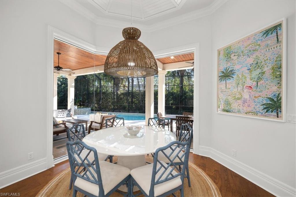 610 Springline Drive Naples, FL 34102 - Photo 17 of 49 a view of a dining room with furniture window and outside view