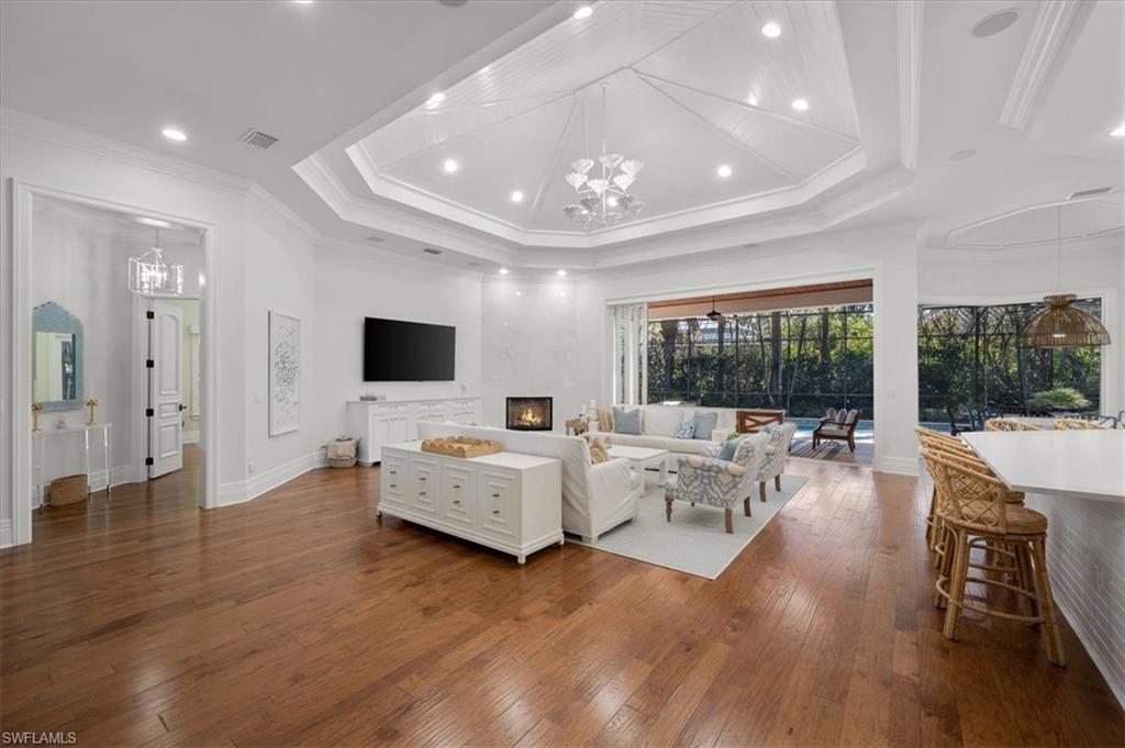 610 Springline Drive Naples, FL 34102 - Photo 19 of 49 a living room with furniture and a flat screen tv