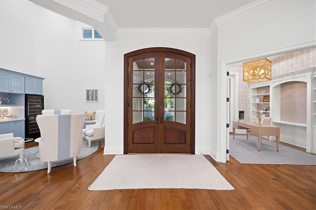 610 Springline Drive Naples, FL 34102 - Photo 22 of 49 a living room with furniture and a window