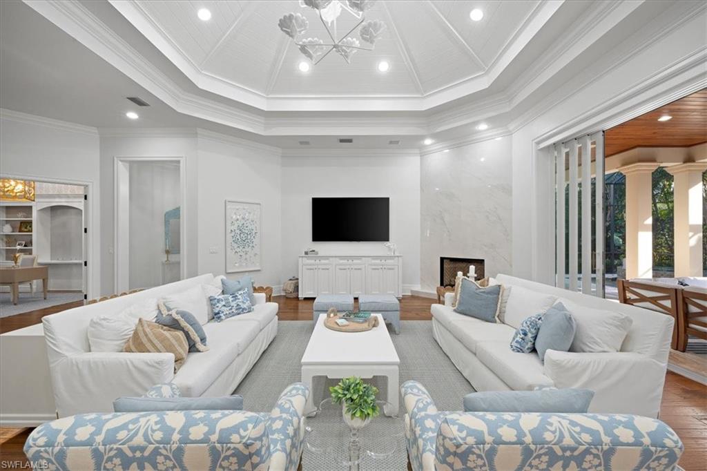 610 Springline Drive Naples, FL 34102 - Photo 24 of 49 a living room with furniture and a flat screen tv