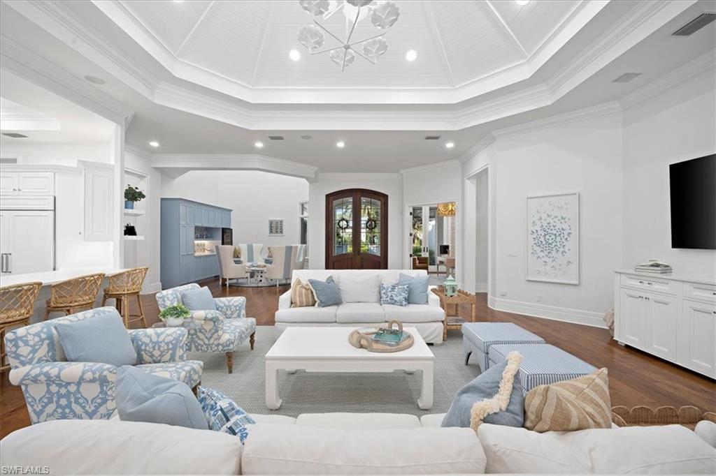 610 Springline Drive Naples, FL 34102 - Photo 25 of 49 a living room with furniture and a flat screen tv