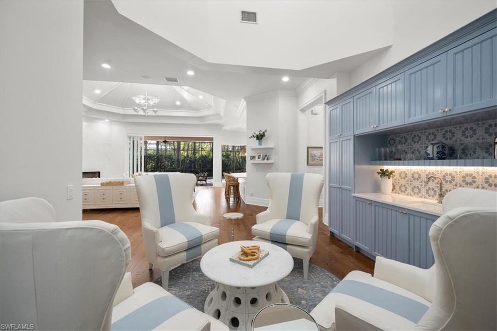 610 Springline Drive Naples, FL 34102 - Photo 27 of 49 a living room with furniture and a table