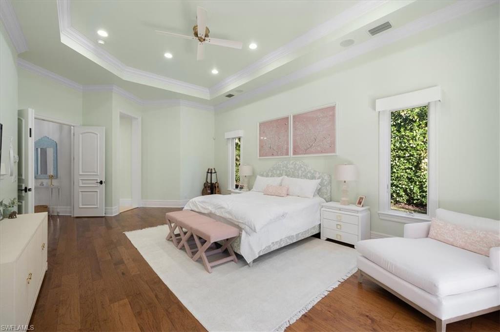 610 Springline Drive Naples, FL 34102 - Photo 31 of 49 a bedroom with a bed couch and a window