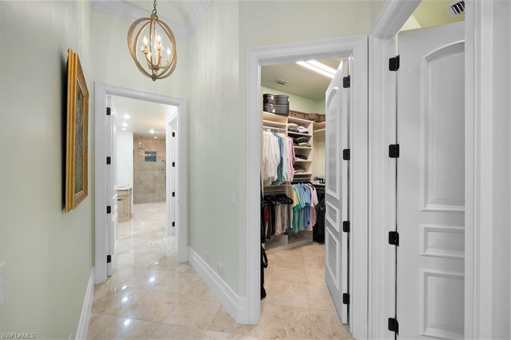 610 Springline Drive Naples, FL 34102 - Photo 32 of 49 a view of a hallway with elevator