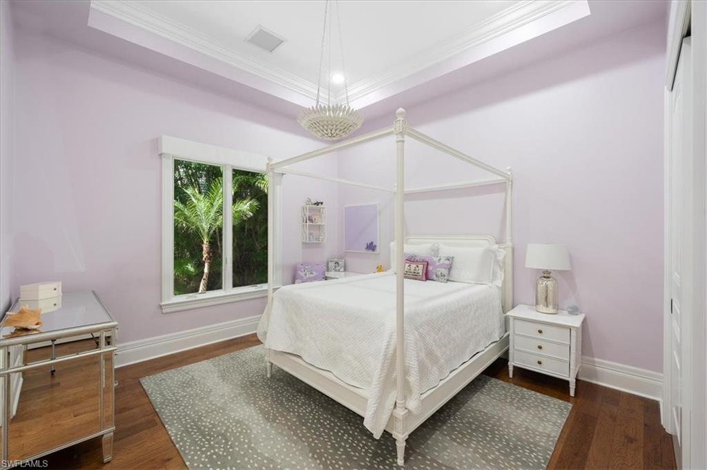 610 Springline Drive Naples, FL 34102 - Photo 41 of 49 a bedroom with a bed and a large window with outer view