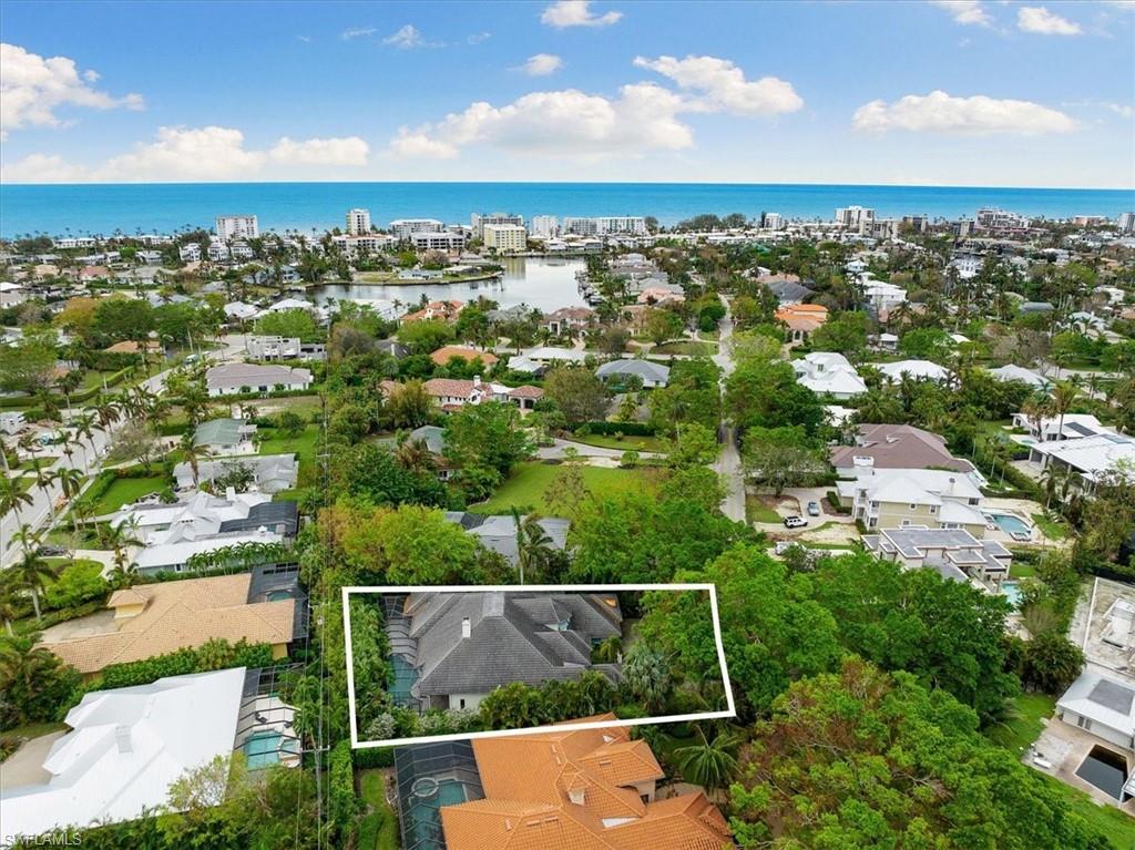 610 Springline Drive Naples, FL 34102 - Photo 47 of 49 an aerial view of a city